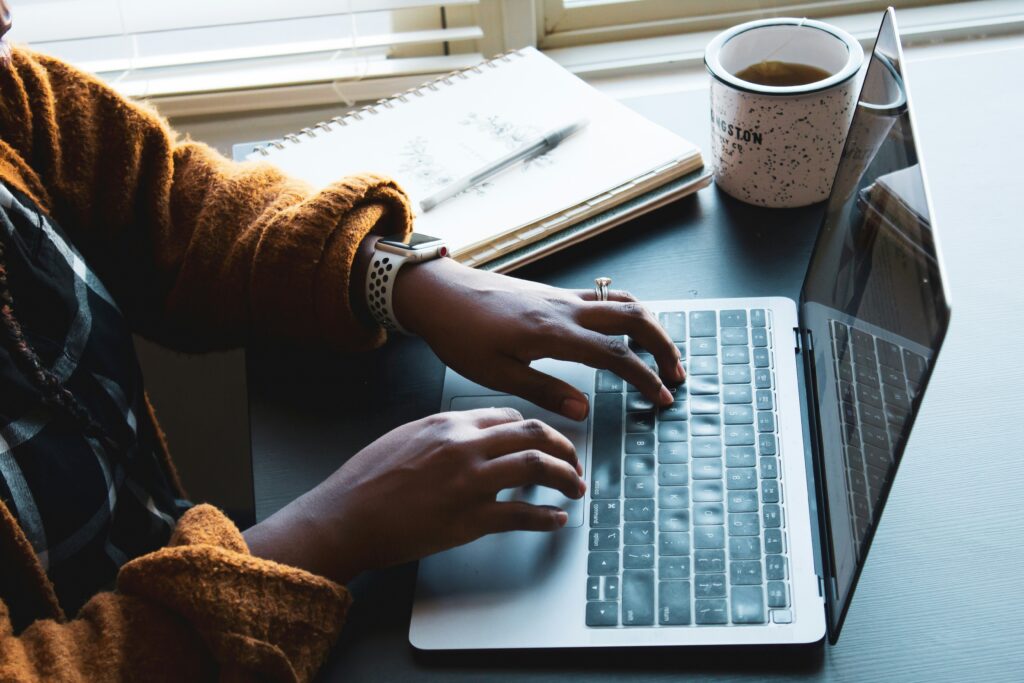 Woman typing on computer